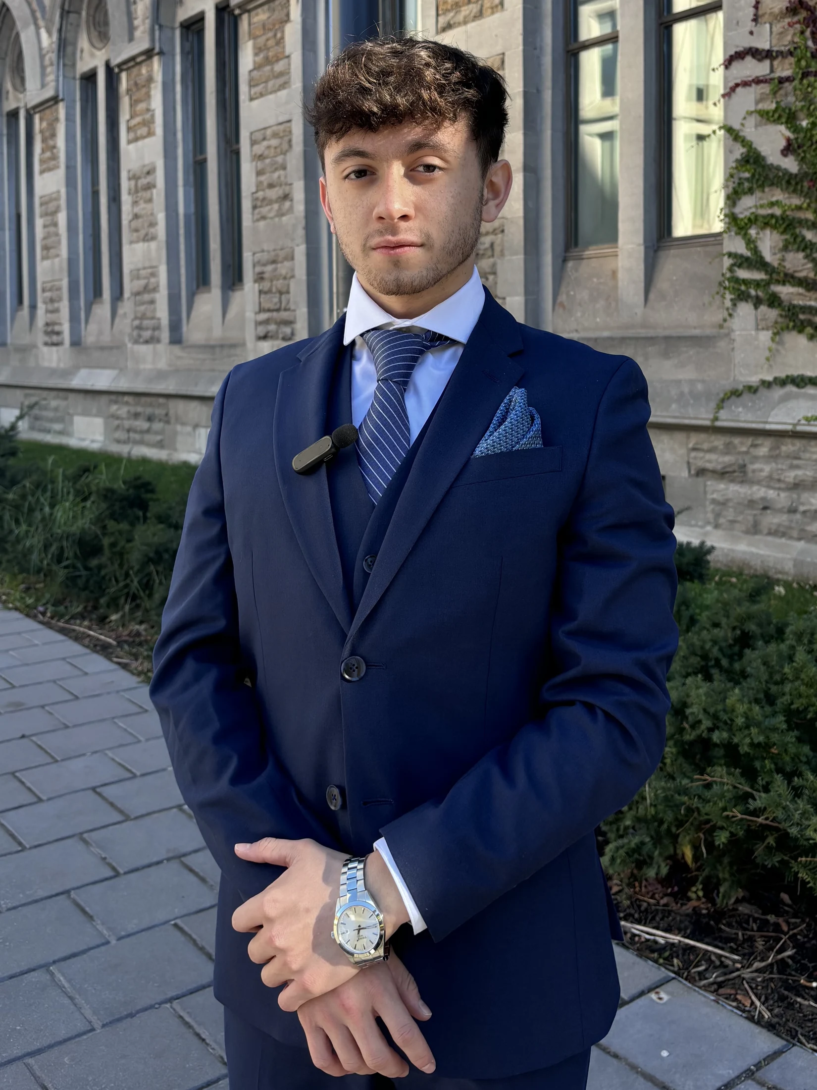 Justice Bongiovanni in a navy three-piece suit